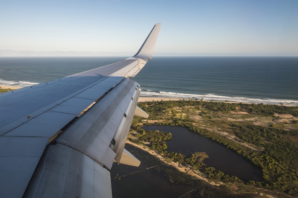 View of airplane wing at sunset, Madagascar, Africa